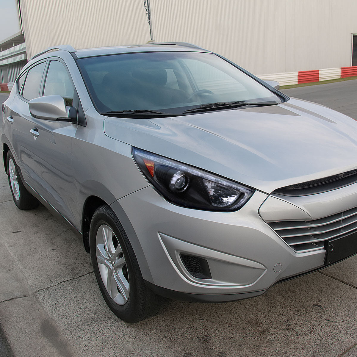 2010-2013 Hyundai Tucson Projector Headlights w/ LED Light Strip (Matte Black Housing/Clear Lens)