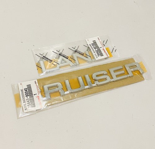 NEW GENUINE FOR TOYOTA  LAND CRUISER J100 98-03 REAR EMBLEMS BADGE SET
