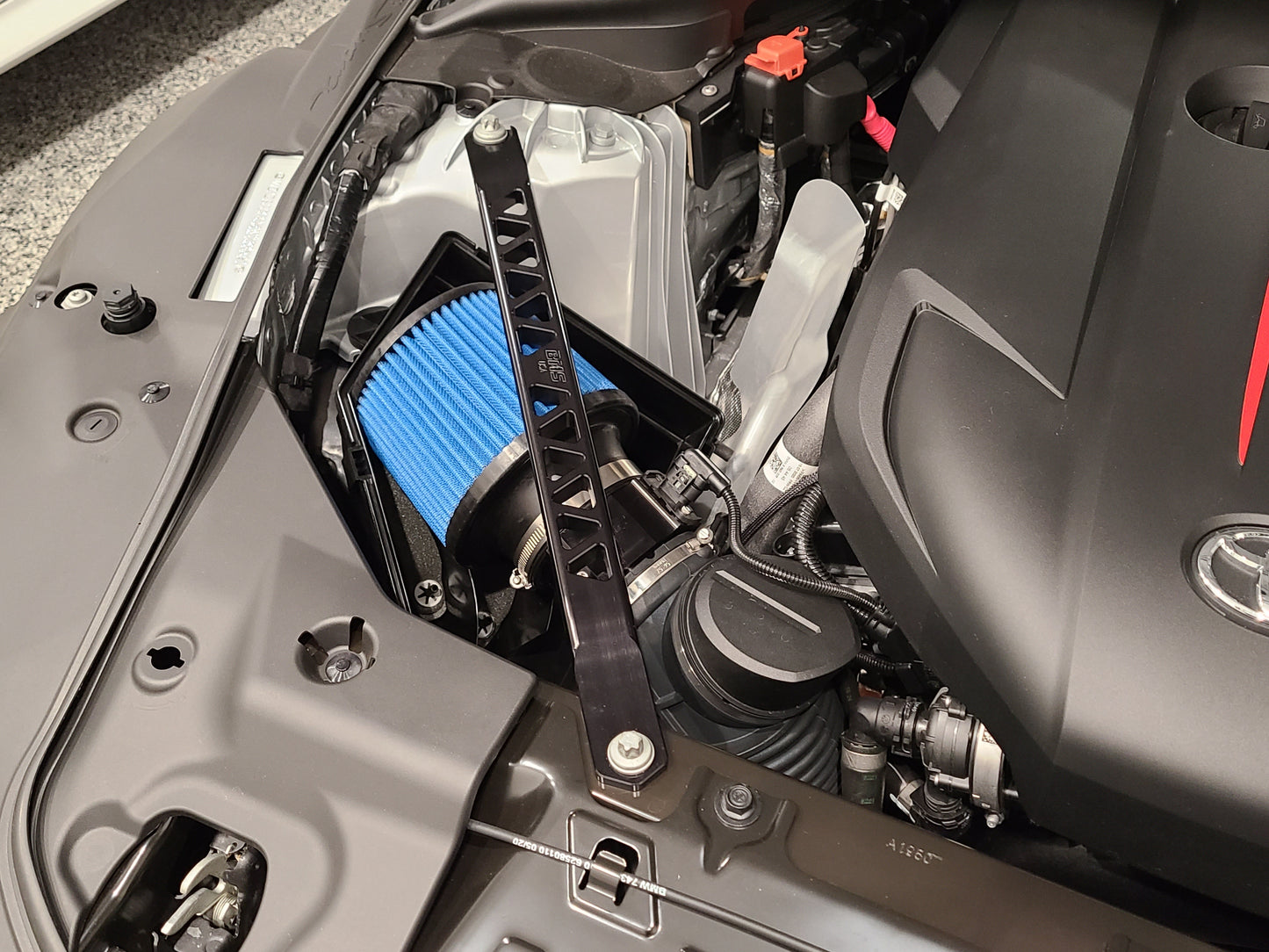 Close up of BMS intake blue filter installed on Supra A90 B58 engine
