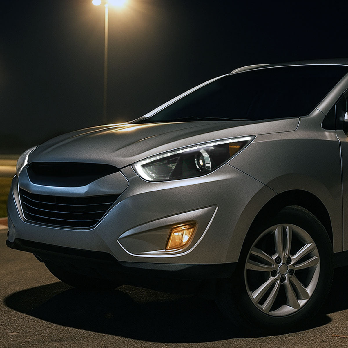 2010-2013 Hyundai Tucson Projector Headlights w/ LED Light Strip (Matte Black Housing/Clear Lens)