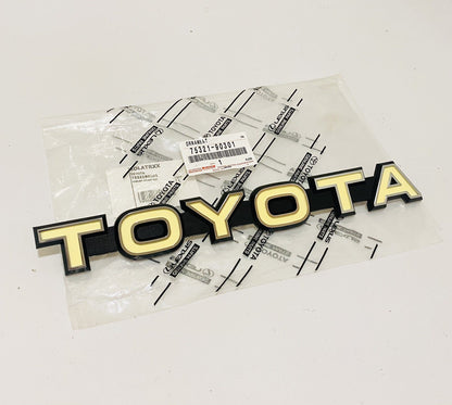 NEW GENUIINE TOYOTA 79-84 LAND CRUISER FJ40 42 43 FRONT GRILLE EMBLEM 7532190301