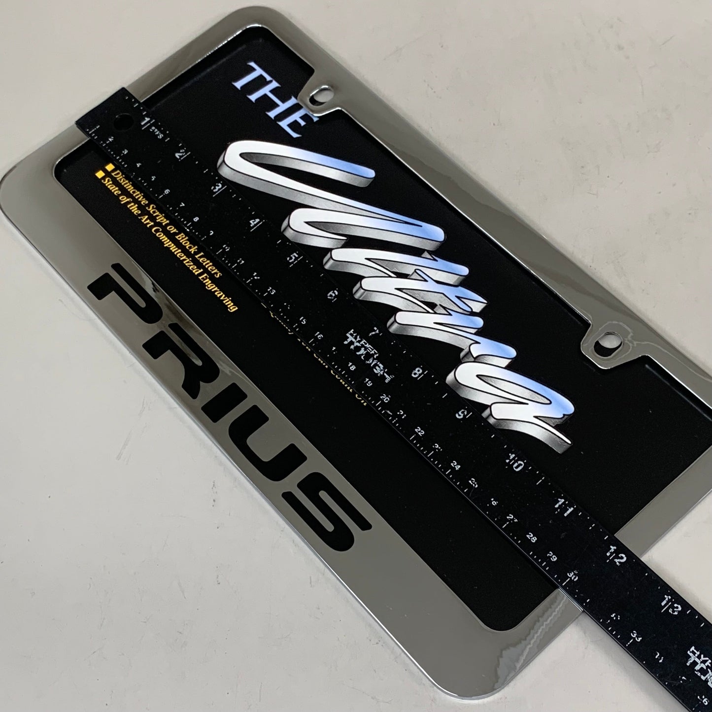 ELITE AUTOMOTIVE PRODUCTS Pruis Emblem Solid Brass License Plate Frame Chrome