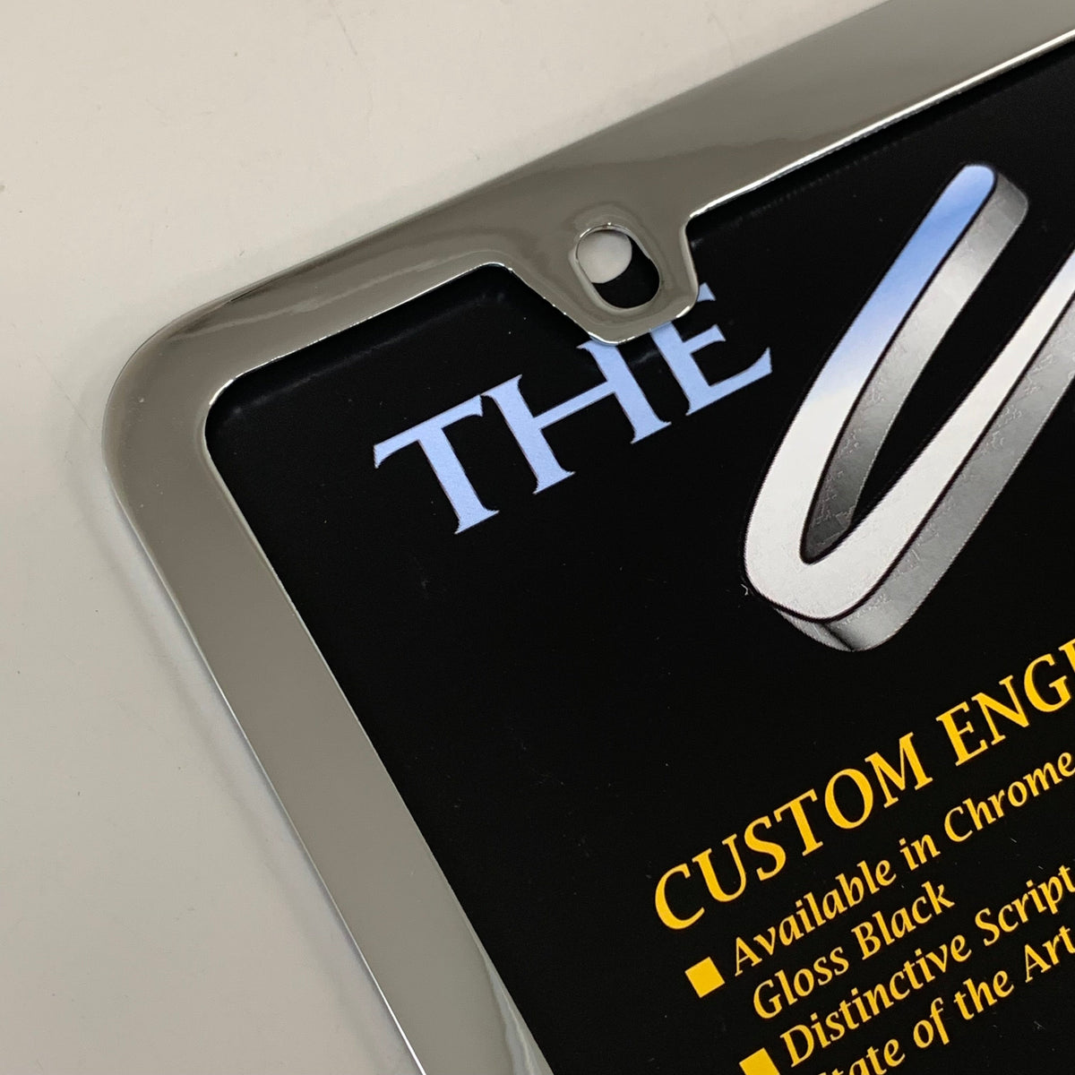 ELITE AUTOMOTIVE PRODUCTS Pruis Emblem Solid Brass License Plate Frame Chrome