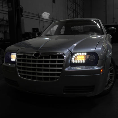 2005-2010 Chrysler 300 Base/LX/Touring Projector Headlights w/ LED Light Strip & LED Turn Signal Lights (Glossy Black Housing/Smoked Lens)