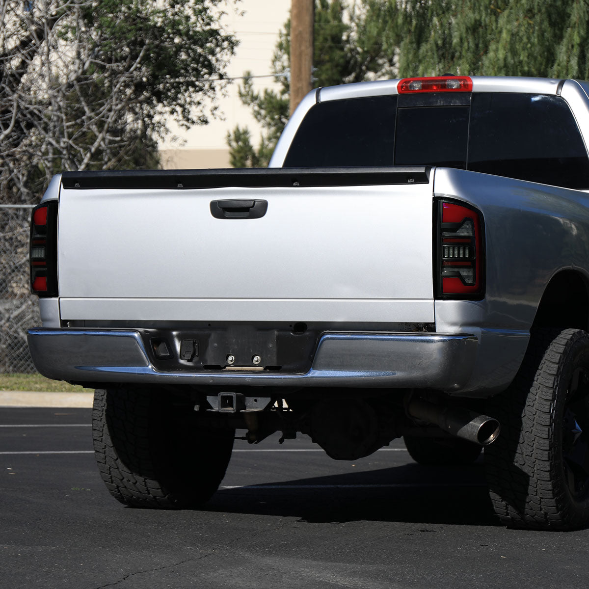 2007-2009 Dodge RAM 1500/2500/3500 Red LED Bar Tail Lights (Matte Black Housing/Smoked Lens)