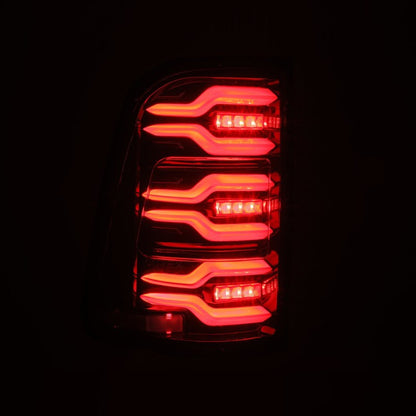 AlphaRex 19-21 Dodge Ram 1500 Luxx-Series LED Tail Lights Alpha-Black w/Activ Light/Seq Signal 640030 *Discontinued