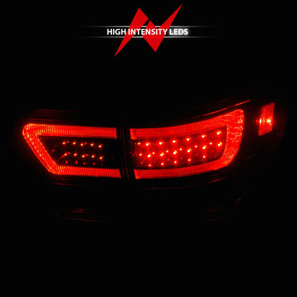 ANZO 11-13 Jeep Grand Cherokee LED Taillights w/ Lightbar Black Housing/Clear Lens 4pcs 311439